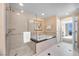 Bright bathroom features a soaking tub and a separate glass-enclosed shower at 125 E Harmon Ave # 1020, Las Vegas, NV 89109