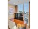 Bedroom with wooden desk and views of the city through its large window at 125 E Harmon Ave # 1020, Las Vegas, NV 89109