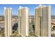 An exterior shot features three high rise towers on a clear day with blue skies in the background at 125 E Harmon Ave # 1020, Las Vegas, NV 89109