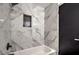 Bathroom with marble tile and bathtub at 145 Hancock St, Las Vegas, NV 89110