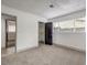 Bright bedroom with neutral carpeting and a large closet at 145 Hancock St, Las Vegas, NV 89110