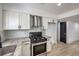 Modern kitchen with stainless steel appliances and granite countertops at 145 Hancock St, Las Vegas, NV 89110