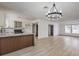 Modern kitchen features granite countertops, stainless steel appliances, and a large island at 145 Hancock St, Las Vegas, NV 89110