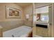 Bathroom with soaking tub and view of bedroom at 211 E Flamingo Rd # 615, Las Vegas, NV 89169