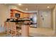 Modern kitchen with stainless steel appliances and breakfast bar at 211 E Flamingo Rd # 615, Las Vegas, NV 89169