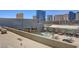 Rooftop pool with city views, lounge chairs, and fire pit at 211 E Flamingo Rd # 615, Las Vegas, NV 89169