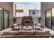 Relaxing patio with built-in fireplace and comfortable seating at 220 Glen Lee St, Henderson, NV 89012