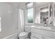 Clean and modern bathroom with a tub, shower, and updated vanity at 220 Glen Lee St, Henderson, NV 89012