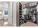 Well-organized walk-in closet with custom shelving and rods at 220 Glen Lee St, Henderson, NV 89012