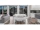 Modern dining area with glass table and bench seating near the kitchen at 220 Glen Lee St, Henderson, NV 89012