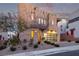 Modern home with stone exterior and a large glass garage door at 220 Glen Lee St, Henderson, NV 89012