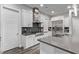 Modern kitchen with stainless steel appliances and gray countertops at 220 Glen Lee St, Henderson, NV 89012