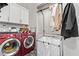 Laundry room with washer, dryer, and storage at 220 Glen Lee St, Henderson, NV 89012