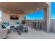 Spacious rooftop deck with sectional seating, a dining area, and stunning views at 220 Glen Lee St, Henderson, NV 89012