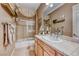 Bathroom with tub shower combo, vanity, and tile flooring at 2412 Templi Scotia St, Henderson, NV 89044