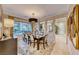 Formal dining room with large table, chandelier, and striped wallpaper at 2412 Templi Scotia St, Henderson, NV 89044