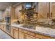 Modern kitchen with gas cooktop and custom cabinetry at 2412 Templi Scotia St, Henderson, NV 89044