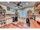 Home office with built-in desk and shelving, hardwood floors at 2412 Templi Scotia St, Henderson, NV 89044