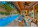 Relaxing pool area with seating and string lights at 2412 Templi Scotia St, Henderson, NV 89044