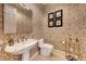 Powder room with pedestal sink and elegant wallpaper at 2412 Templi Scotia St, Henderson, NV 89044