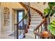 Elegant curved staircase with ornate railing at 2412 Templi Scotia St, Henderson, NV 89044