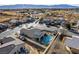 Real estate featuring a solar panel system, a swimming pool, and desert landscaping at 2540 E Sparrow Way, Pahrump, NV 89048