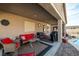 Comfortable backyard patio featuring outdoor seating, a built-in grill, and access to a pool at 2540 E Sparrow Way, Pahrump, NV 89048