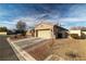 A single-story home features a two-car garage, desert landscaping, and a gated backyard at 2540 E Sparrow Way, Pahrump, NV 89048