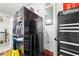 Close-up of garage with storage, utility boxes, refrigerator, and a rolling toolbox at 2540 E Sparrow Way, Pahrump, NV 89048