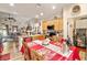 Spacious kitchen and living room area featuring stainless steel appliances and island seating at 2540 E Sparrow Way, Pahrump, NV 89048