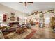 Comfortable living room featuring hardwood floors and decorative shelves leading into kitchen at 2540 E Sparrow Way, Pahrump, NV 89048