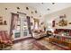 Cozy living room featuring hardwood floors, neutral walls, and patio access at 2540 E Sparrow Way, Pahrump, NV 89048
