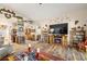Open-concept living room with hardwood floors and neutral walls at 2540 E Sparrow Way, Pahrump, NV 89048