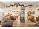 Spacious open-concept kitchen and living room with hardwood floors at 2540 E Sparrow Way, Pahrump, NV 89048