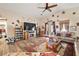 Comfortable living room featuring vaulted ceilings, a fireplace, and hardwood floors at 2540 E Sparrow Way, Pahrump, NV 89048
