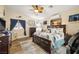 Main bedroom features a ceiling fan, natural light, and wood-look flooring at 2540 E Sparrow Way, Pahrump, NV 89048