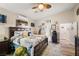 Spacious main bedroom features a ceiling fan, natural light, and wood-look flooring at 2540 E Sparrow Way, Pahrump, NV 89048