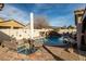 Gorgeous pool with waterfall and landscaped backyard. Plenty of seating for entertaining around the pool at 2540 E Sparrow Way, Pahrump, NV 89048
