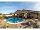 A beautiful outdoor pool and patio area perfect for entertaining or relaxing at 2540 E Sparrow Way, Pahrump, NV 89048
