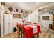 Cozy dining area with red table linens and wooden chairs at 2540 Sparrow Way, Pahrump, NV 89048