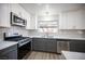 Newly remodeled kitchen with gray and white shaker cabinets at 2541 Showcase Dr, Las Vegas, NV 89134