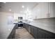 Modern kitchen with gray and white cabinets and quartz countertops at 2541 Showcase Dr, Las Vegas, NV 89134