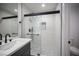 Updated bathroom features a walk-in shower with mosaic tile and a modern vanity at 2541 Showcase Dr, Las Vegas, NV 89134