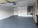 Attached garage with epoxy flooring and extra storage space at 2541 Showcase Dr, Las Vegas, NV 89134