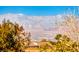 Aerial view showcasing houses and mountain views at 2589 Sumter St, Henderson, NV 89052