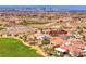 Aerial view of community, golf course, and city skyline at 2589 Sumter St, Henderson, NV 89052