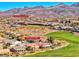 Aerial view of a residential community near mountains and golf course at 2589 Sumter St, Henderson, NV 89052