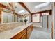 Elegant bathroom with double sinks, a soaking tub, and shower at 2589 Sumter St, Henderson, NV 89052