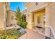 Courtyard entry with a fountain and desert landscaping at 2589 Sumter St, Henderson, NV 89052