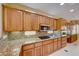 Modern kitchen with granite countertops and stainless steel appliances at 2589 Sumter St, Henderson, NV 89052